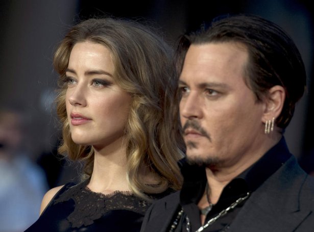 Johnny Depp og fyrrverandi kona hansara, Amber Heard (Mynd: EPA)
