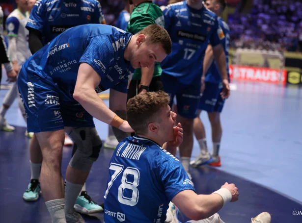 Óli Mittún eftir harða takkling móti Slovenia í EM-endaspælinum. Nú fekk føroyska stjørnan ein snudd (Savnsmynd: Jóanis Albert Nielsen/jn.fo)